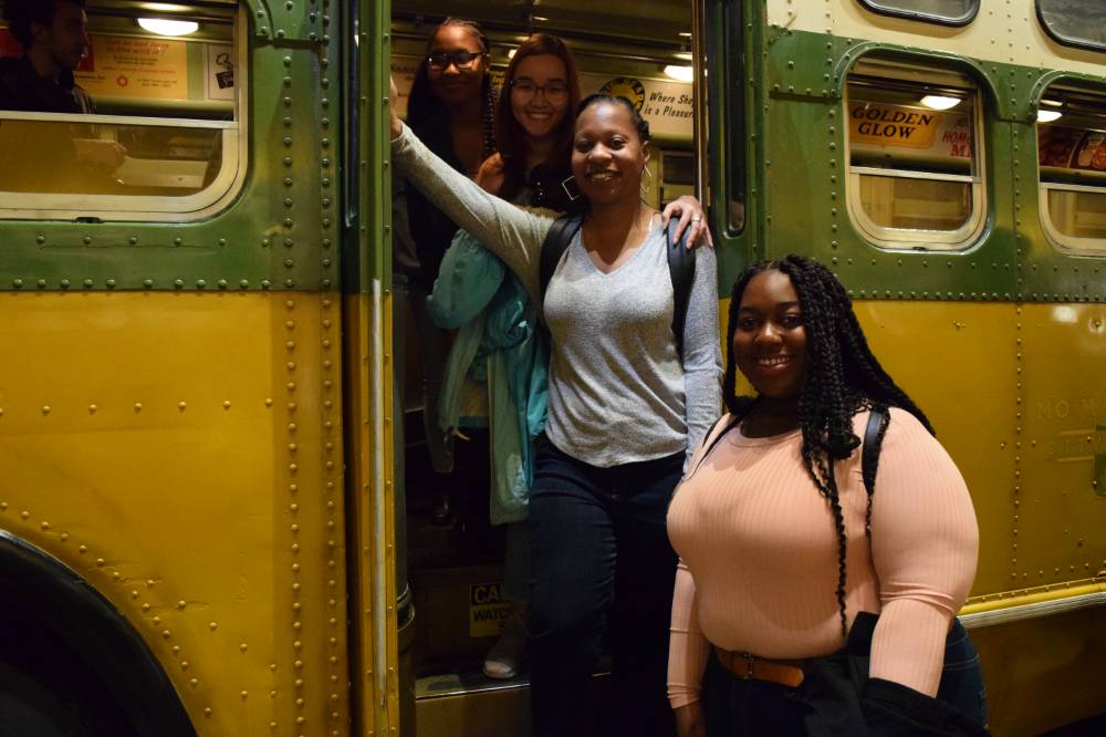 Photo of TRIO students and advisor on freedom riders bus in museum